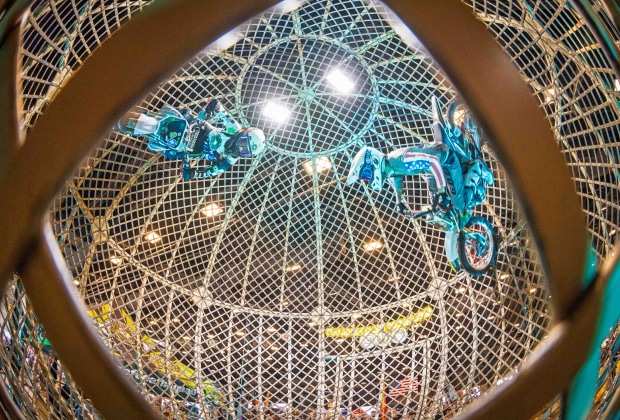 Multiple Freestyle Motocross Riders Performing The Globe Of Death Stunt At The Brigade FMX Stunt Show