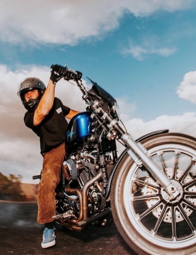 Stunt Rider Weston Schueller Performing A Precision Motorcycle Maneuver During A Live Stunt Show
