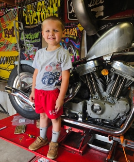 Steve Wendig's Kid Posing With Bike